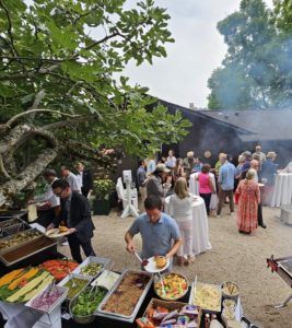 People enjoying food served in open area