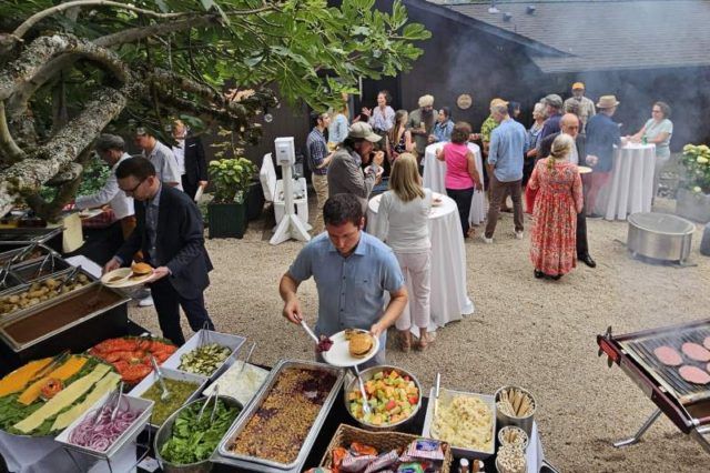People enjoying food served in open area