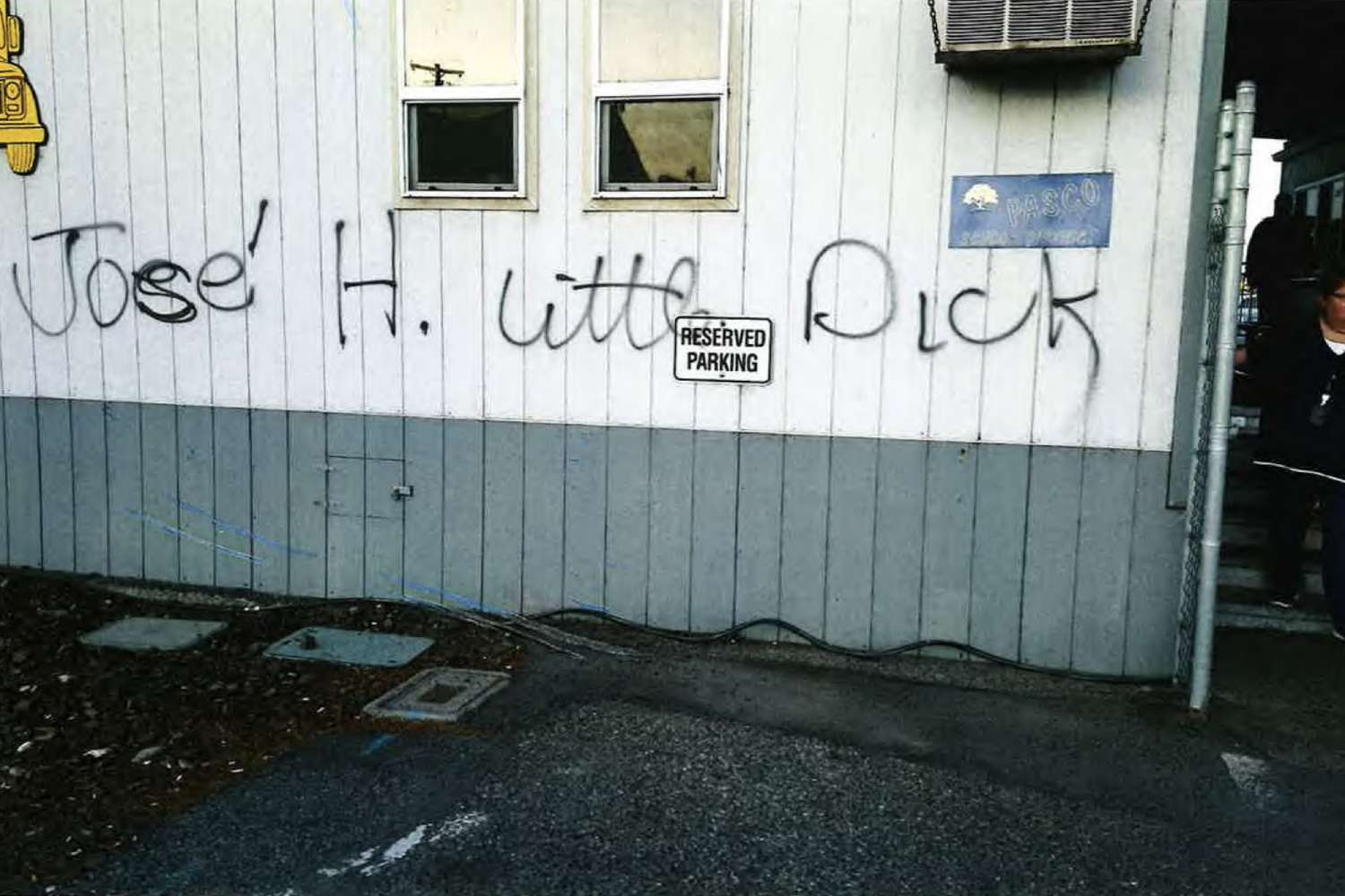 a building with graffiti written on the side of it